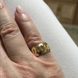 14k solid yellow gold band ring. Love the ring, its beautiful.